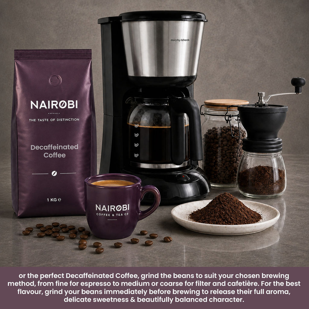 Nairobi Coffee decaffeinated beans with a filter coffee machine, hand grinder, ground coffee and a purple mug